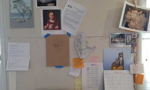 Homasote bulletin board covered with muslin. 